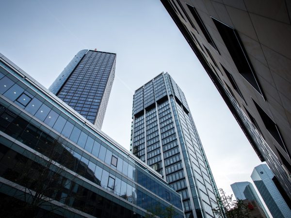 A low angle shot of high rise buildings under the clear sky in Frankfurt, Germany