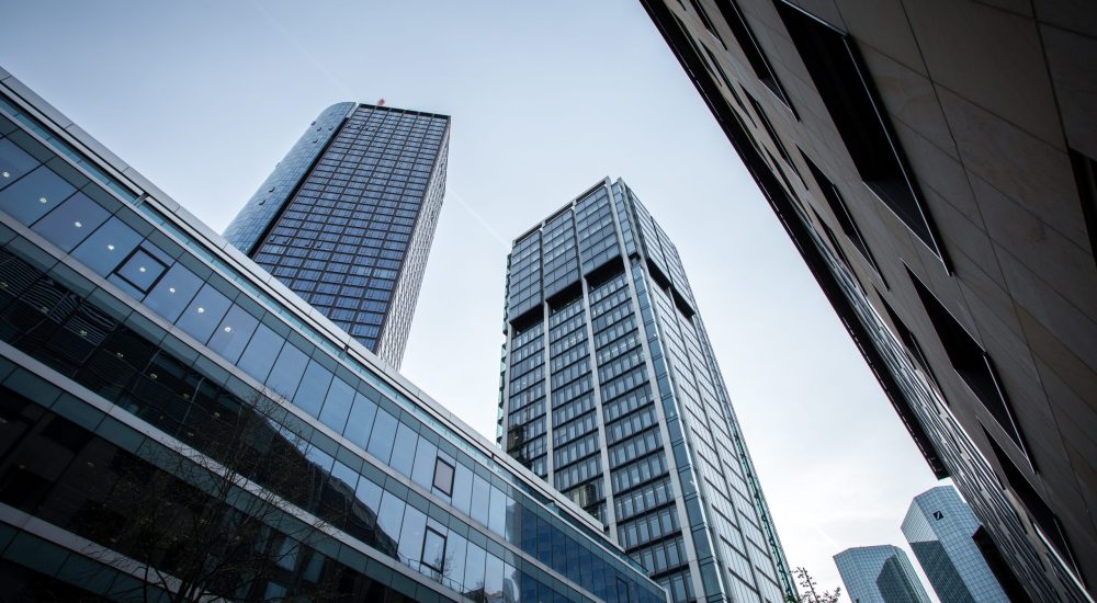 A low angle shot of high rise buildings under the clear sky in Frankfurt, Germany