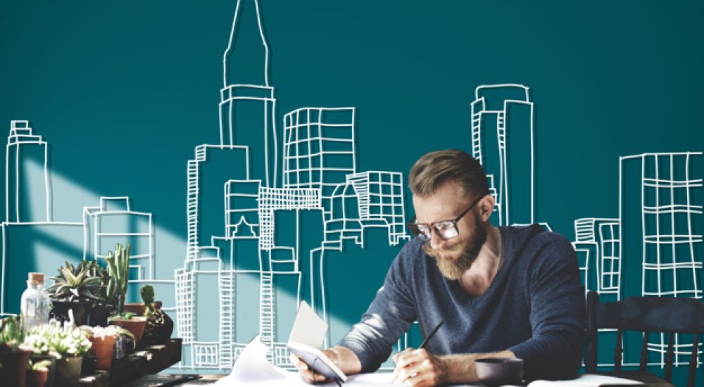 Caucasian man working with building illustration on green background